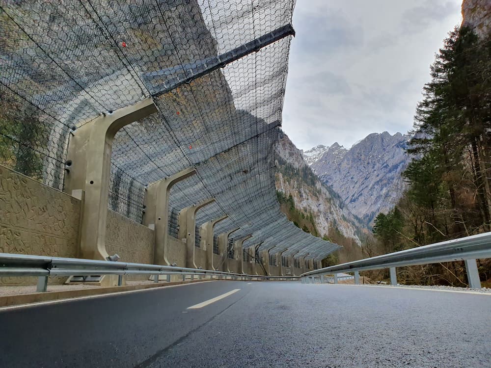 Slope stabilisation nets & rockfall barriers: Pictured rockfall fence on roadway.