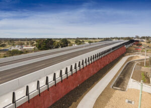 Precast wall panels in rich ochre design at Barwon Heads Road Upgrade project in Victoria.