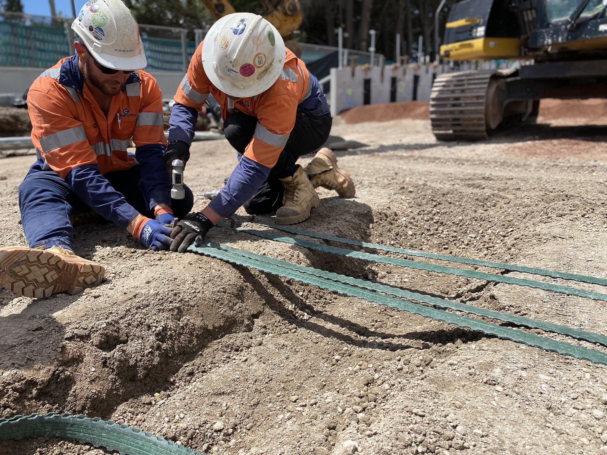 EcoStrap HA, sustainable reinforcements for MSE walls, by Geoquest Australia being installed at Diggers Rest Level Crossing Removal project in Victoria.