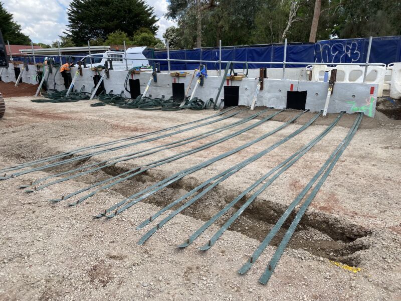 EcoStrap HA, sustainable reinforcements for MSE walls, by Geoquest Australia being installed at Diggers Rest Level Crossing Removal project in Victoria.