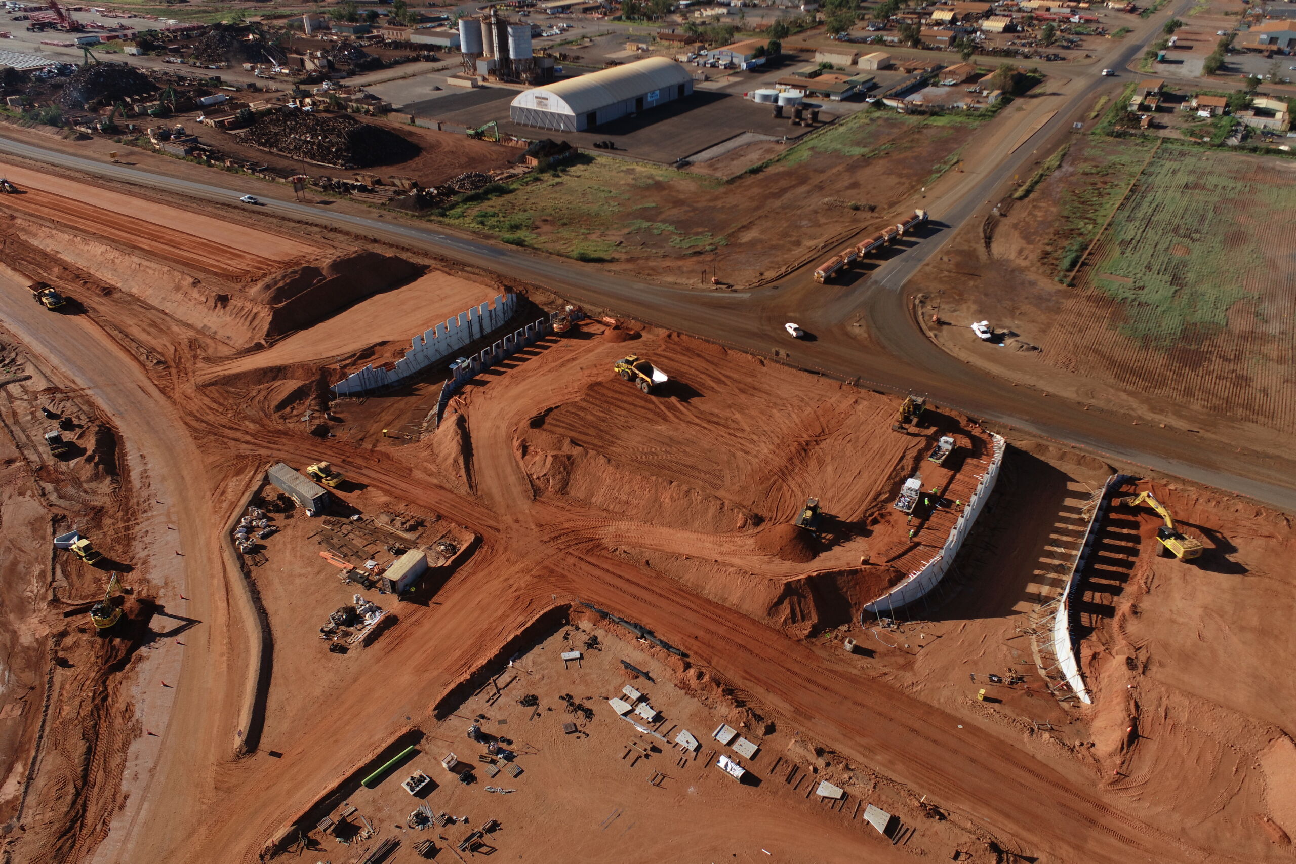 A reinforced earth wall (MSE wall) at the Sydney Gateway project, New South Wales, which has pre cast concrete facing panels with decorative elements engraved.