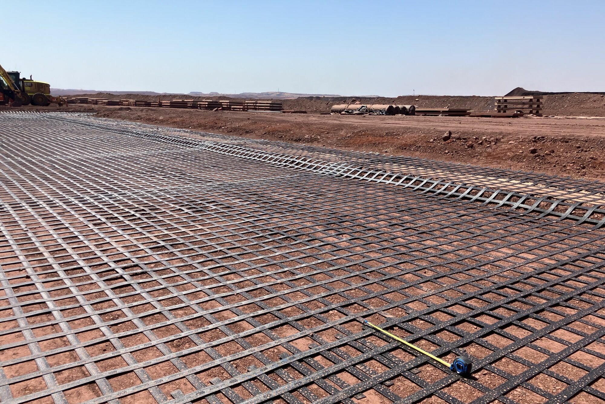 Pilbara mine site geosynthetics ground reinforcement, ArmaLynk by Geoquest being installed.