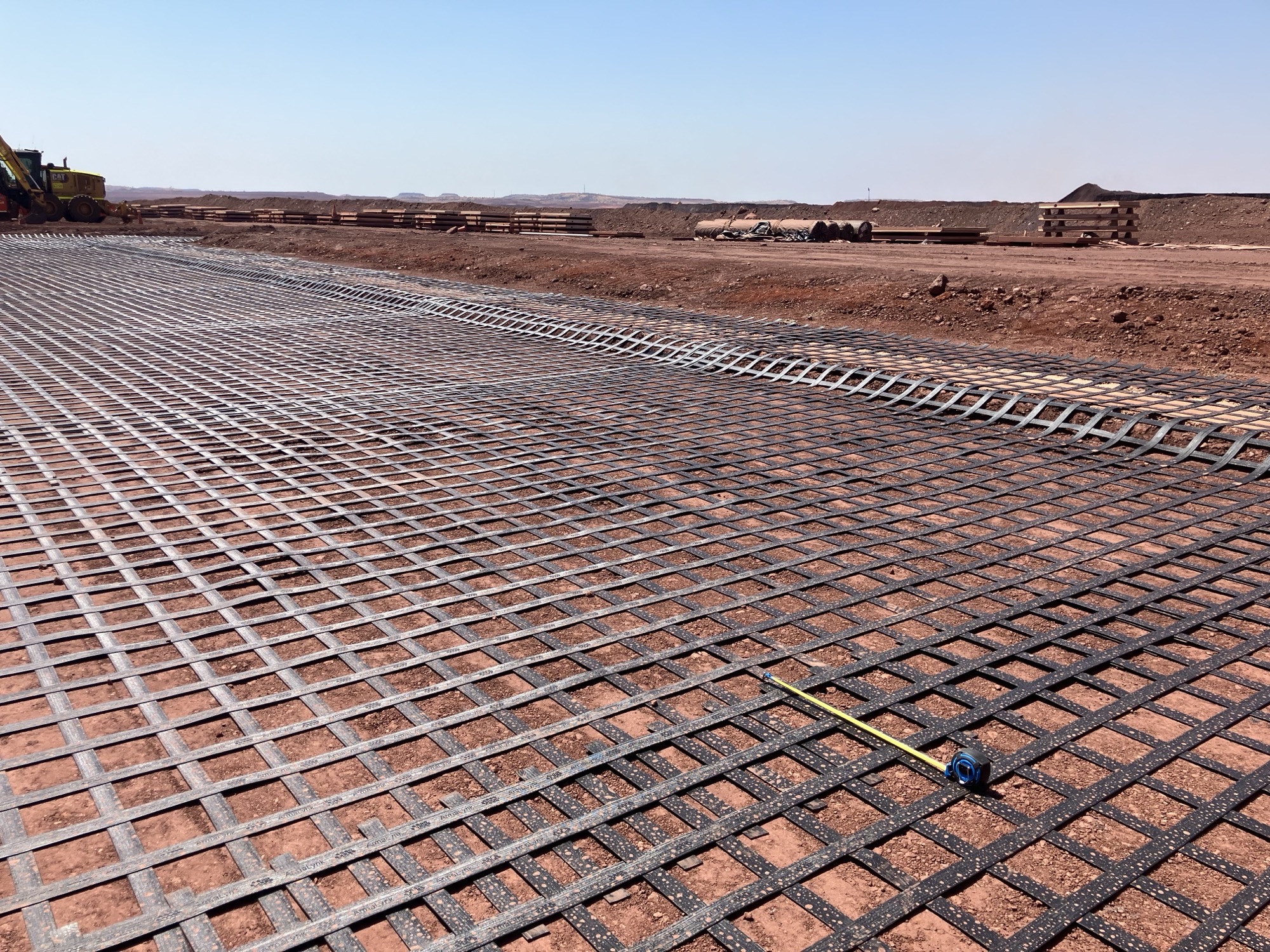 Roy Hill Mine Pilbara geosynthetics ground reinforcement Pilbara mine site geosynthetics ground reinforcement, ArmaLynk by Geoquest being installed.