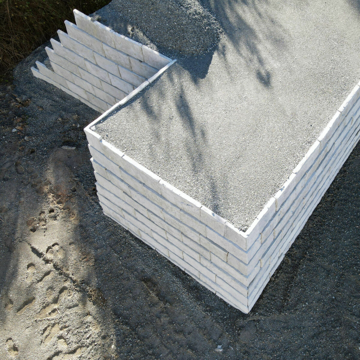 modular retaining wall concrete TerraStack Modular retaining wall aerial view, white grey concrete blocks creating the wall
